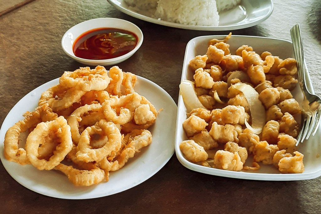 Plate of calamares and buttered scallops at Omagieca Restaurant in Bantayan Island