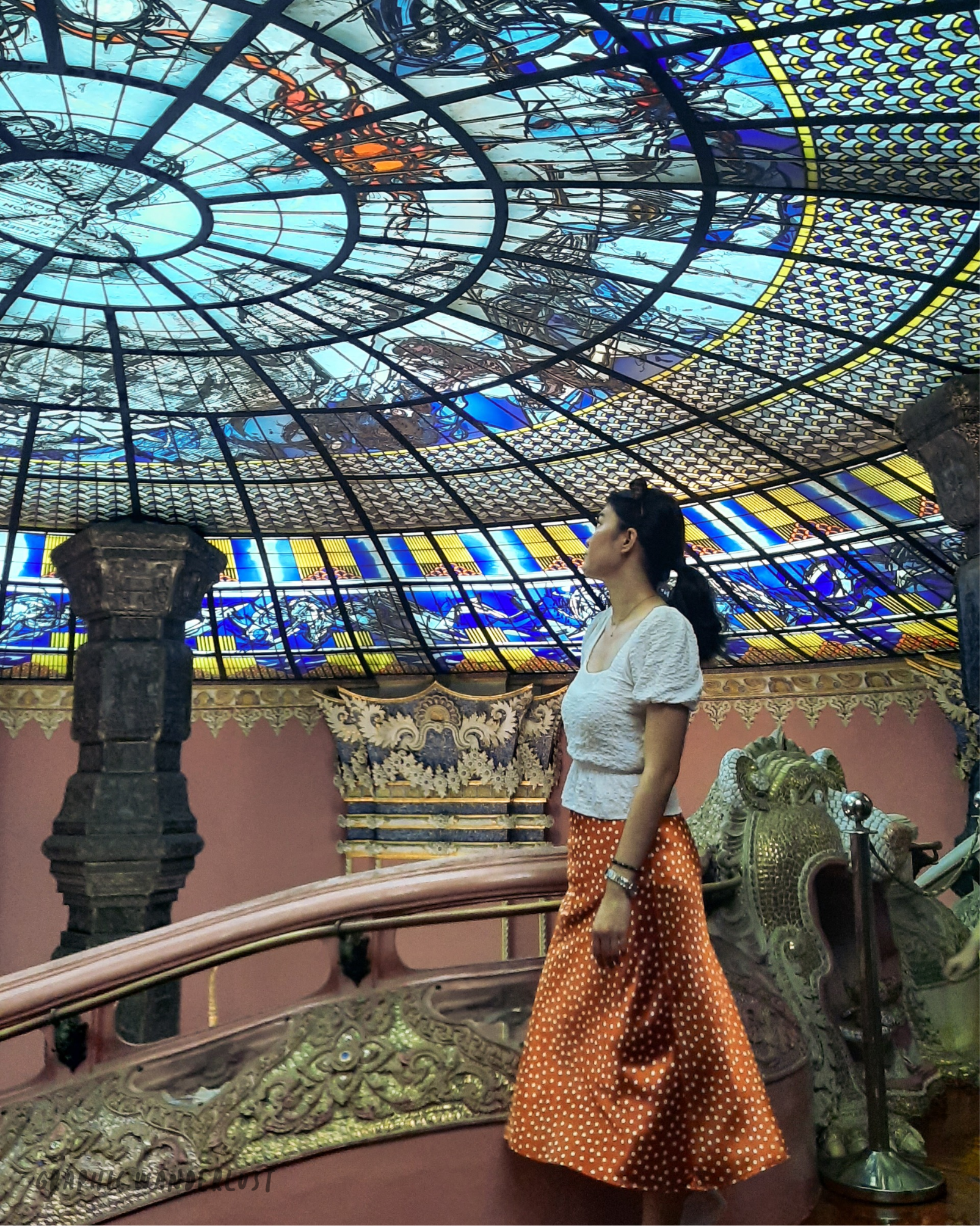 Girl posing with the stained glass ceiling at the second floor of Erawan Museum