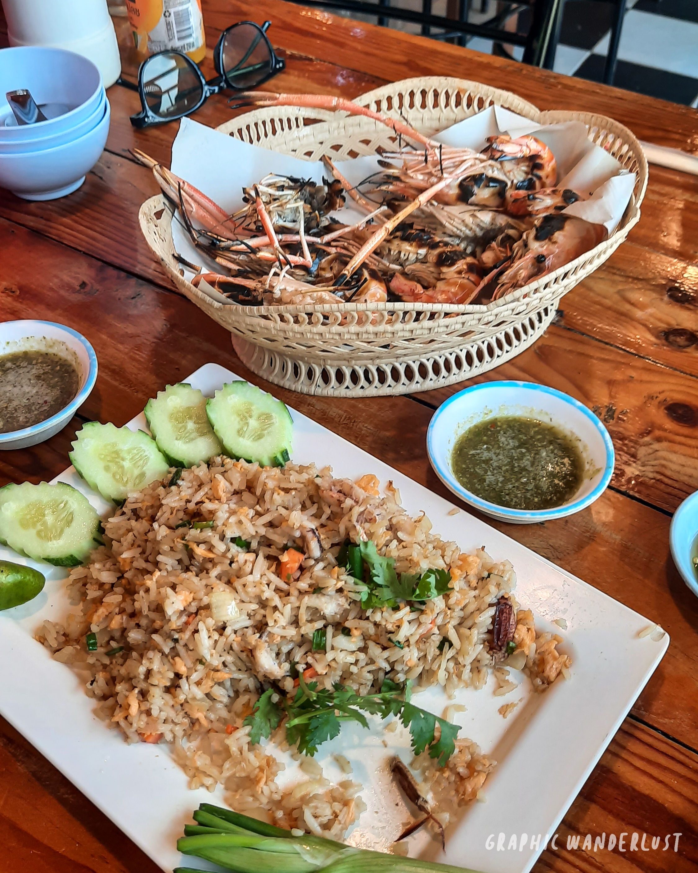 Serving of Ayutthaya's grilled river prawns and crab rice