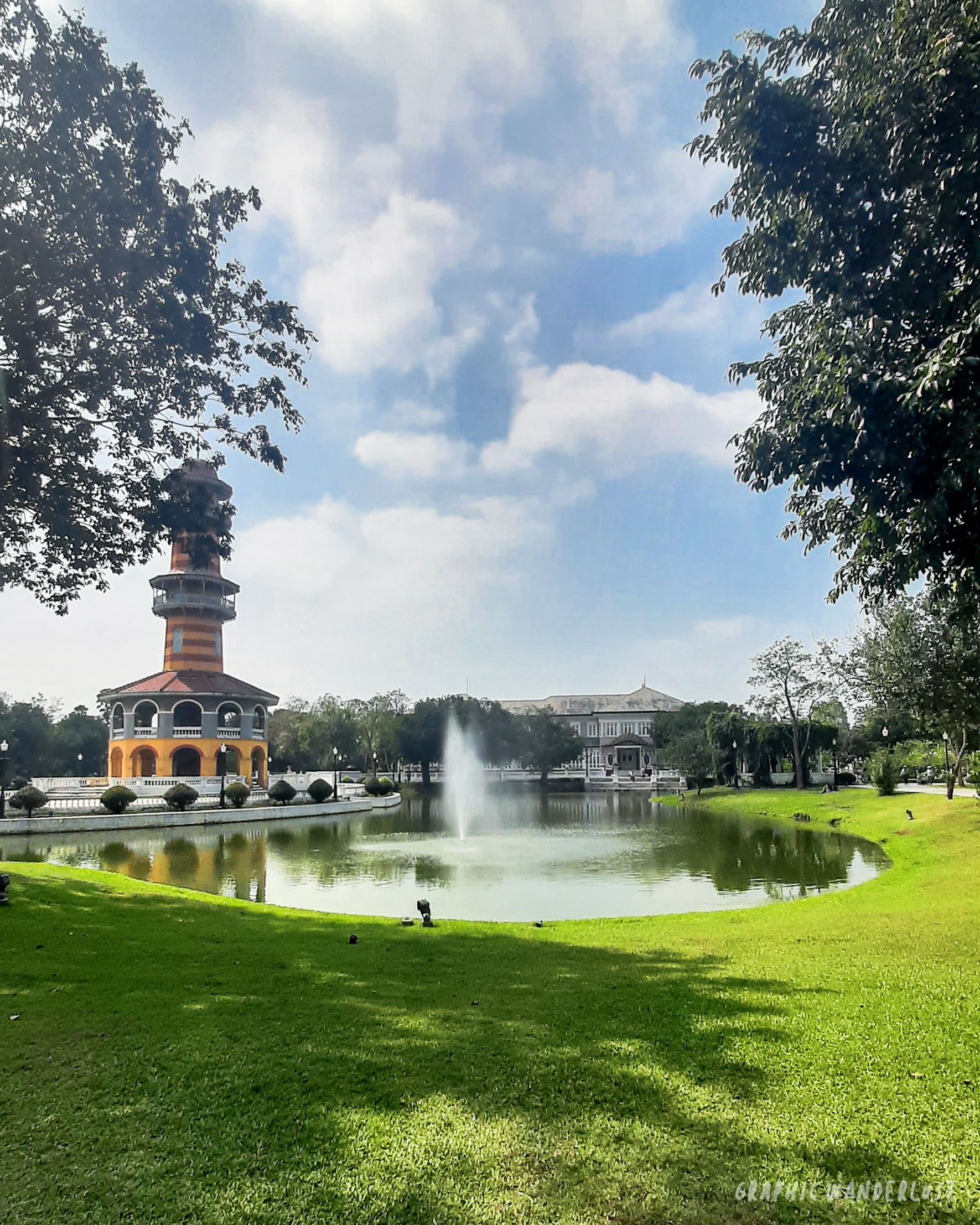 A watchtower and building surrounding a man-made lake in Bang Pa-in Palace