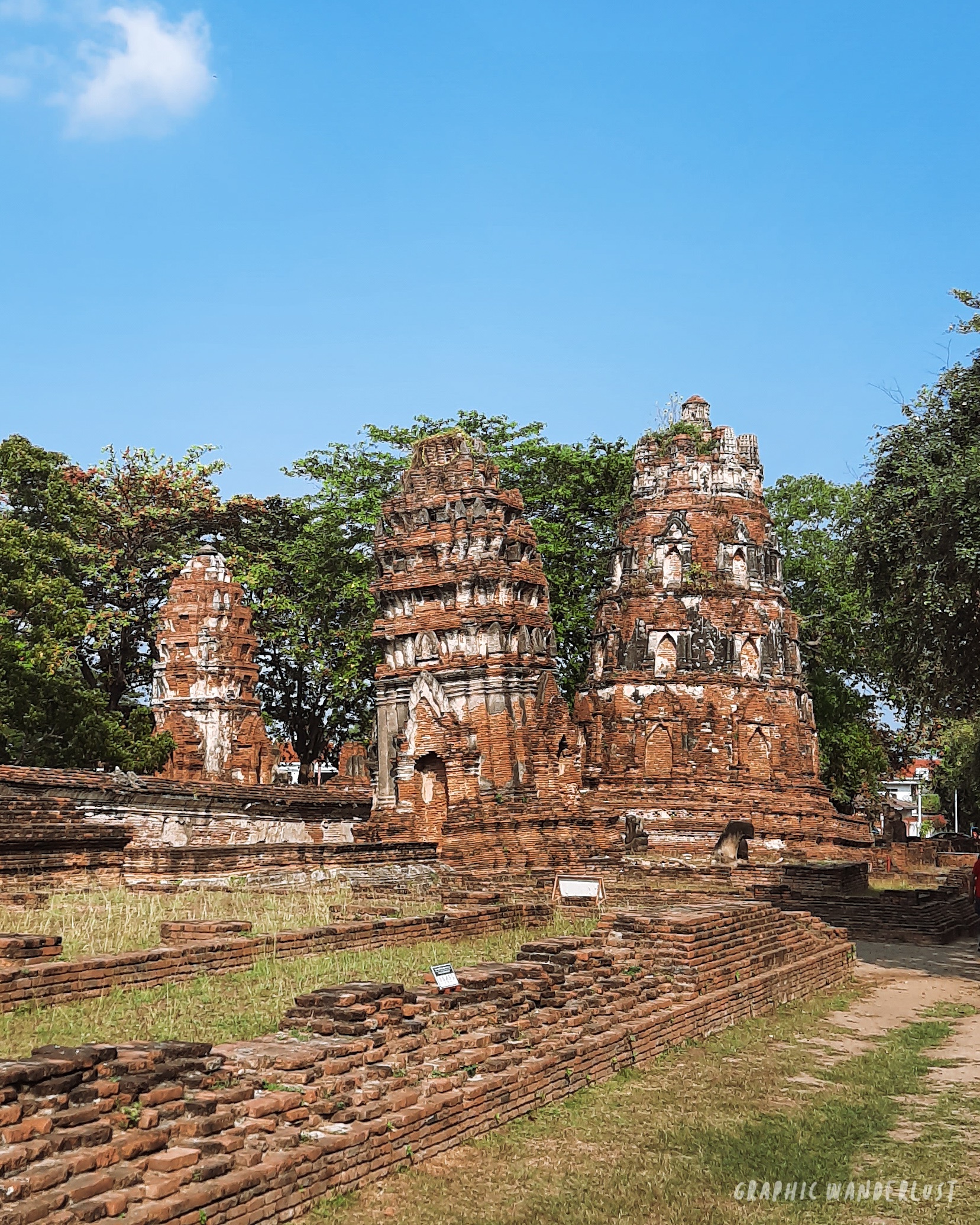 Three Khmer-styled prangs lined in a part of Wat Mahathat