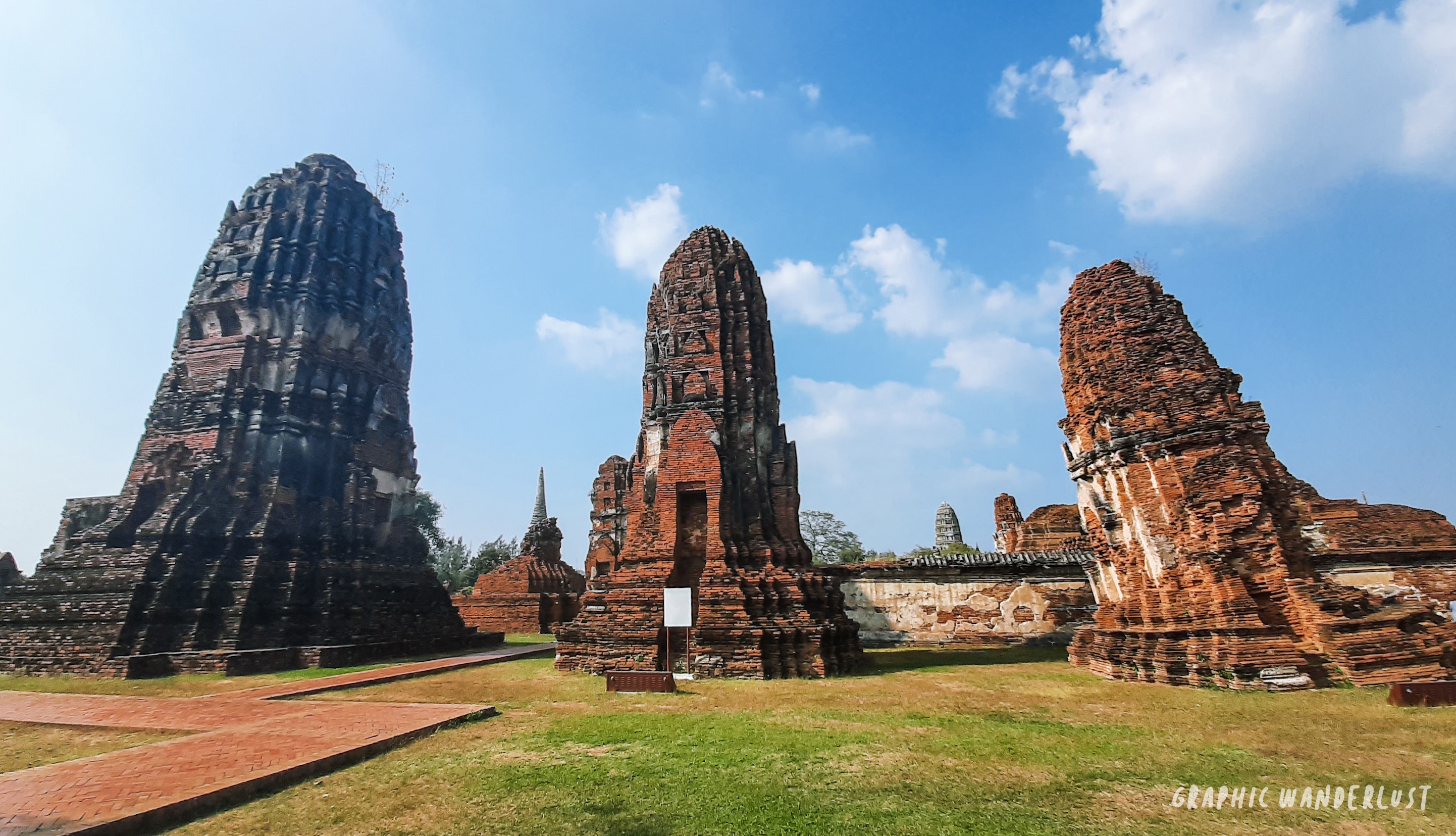 Three Khmer-styled prangs lined in a part of Wat Mahathat
