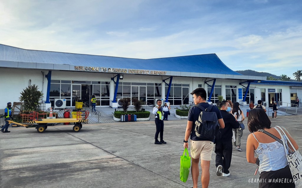 People going inside the arrival gate of Siargao Airport. 