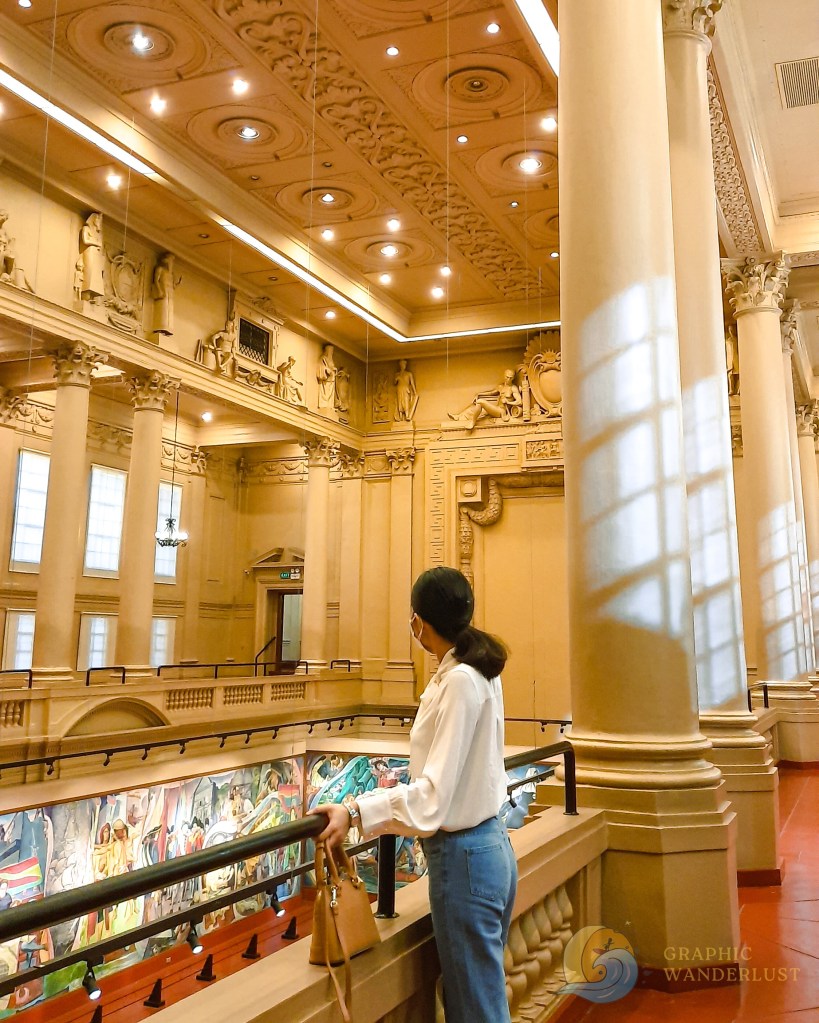 A girl standing along the railing overlooking the former Session Hall in National Museum of Fine Arts