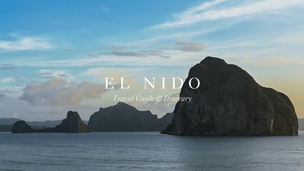 View of limestone cliffs surrounded by water during sunset