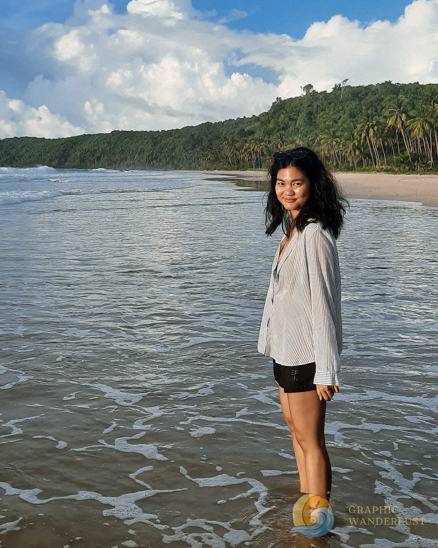 Portrait of a girl standing by the shore
