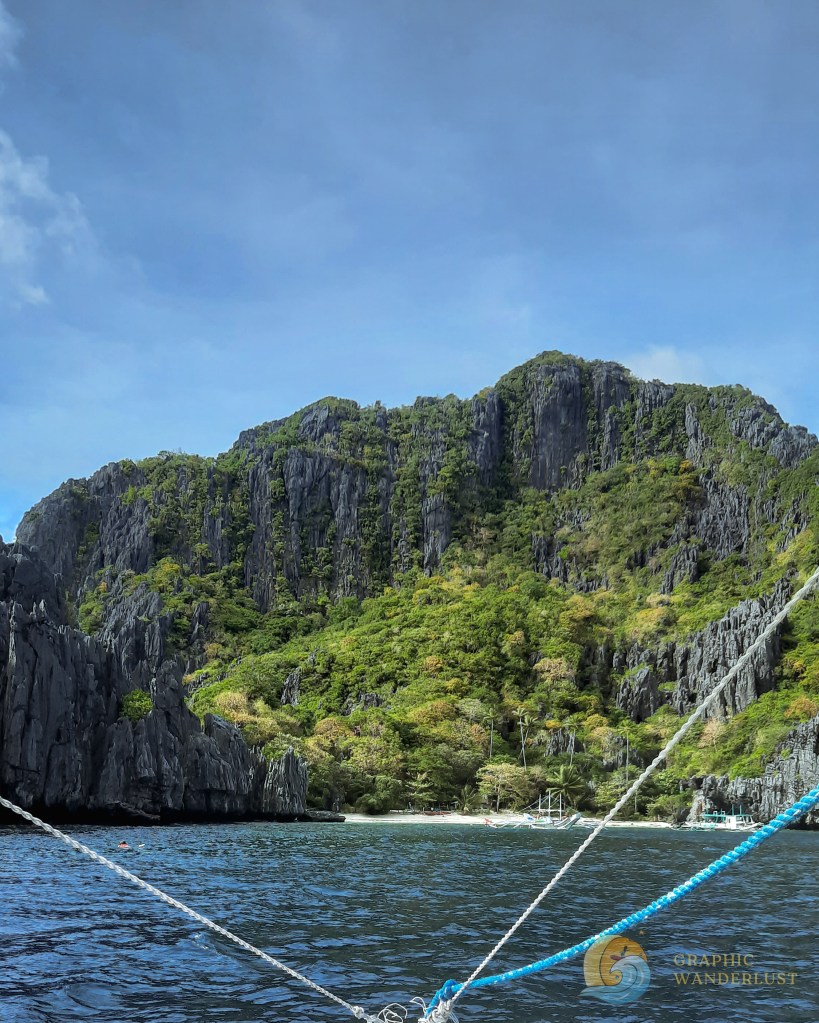View of an island towered by a limestone cliff