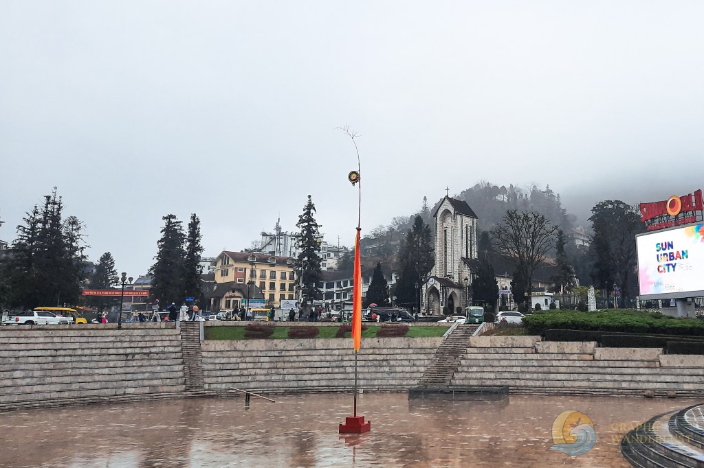 Foggy town square surrounded by buildings