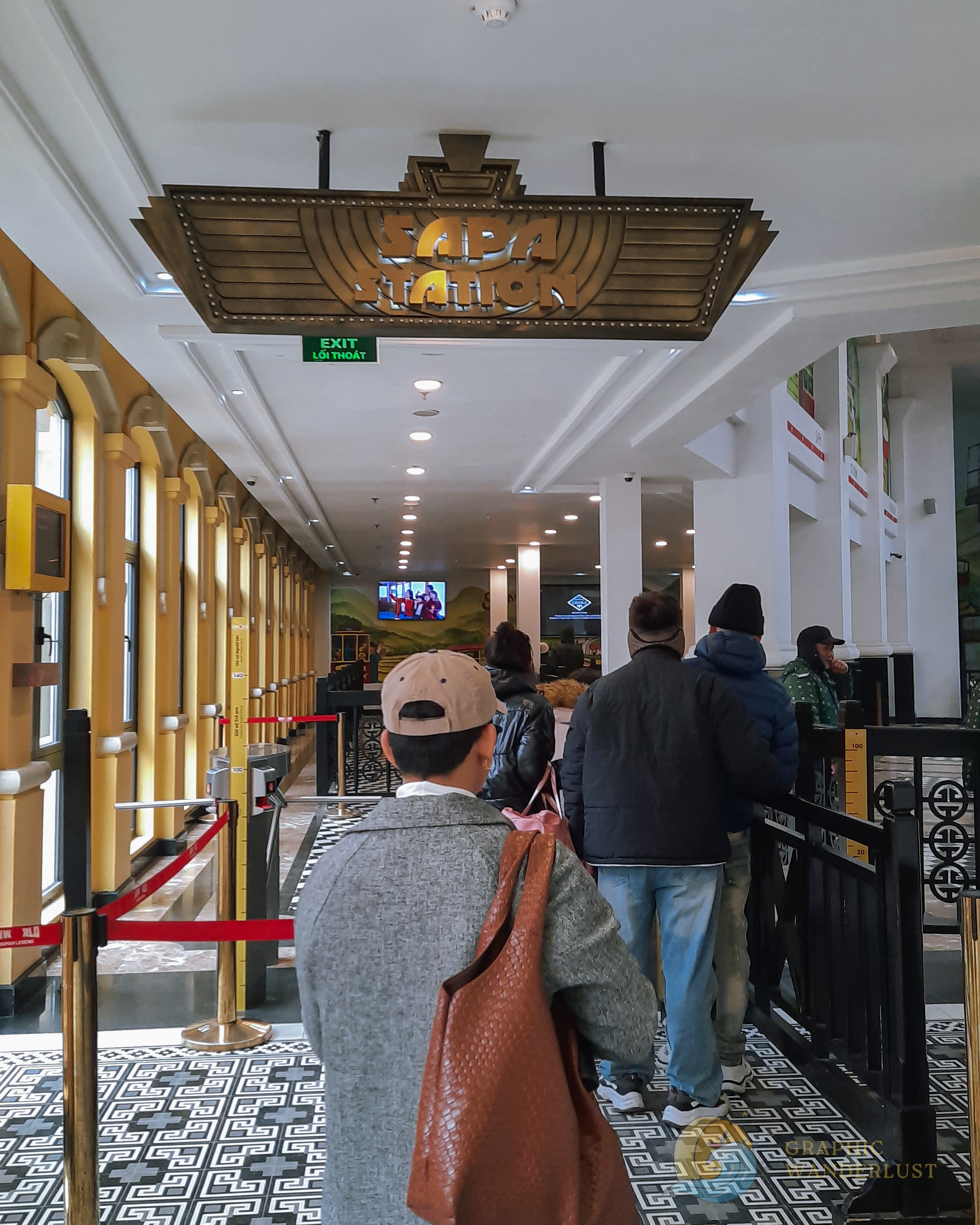 People lining up to enter a train station