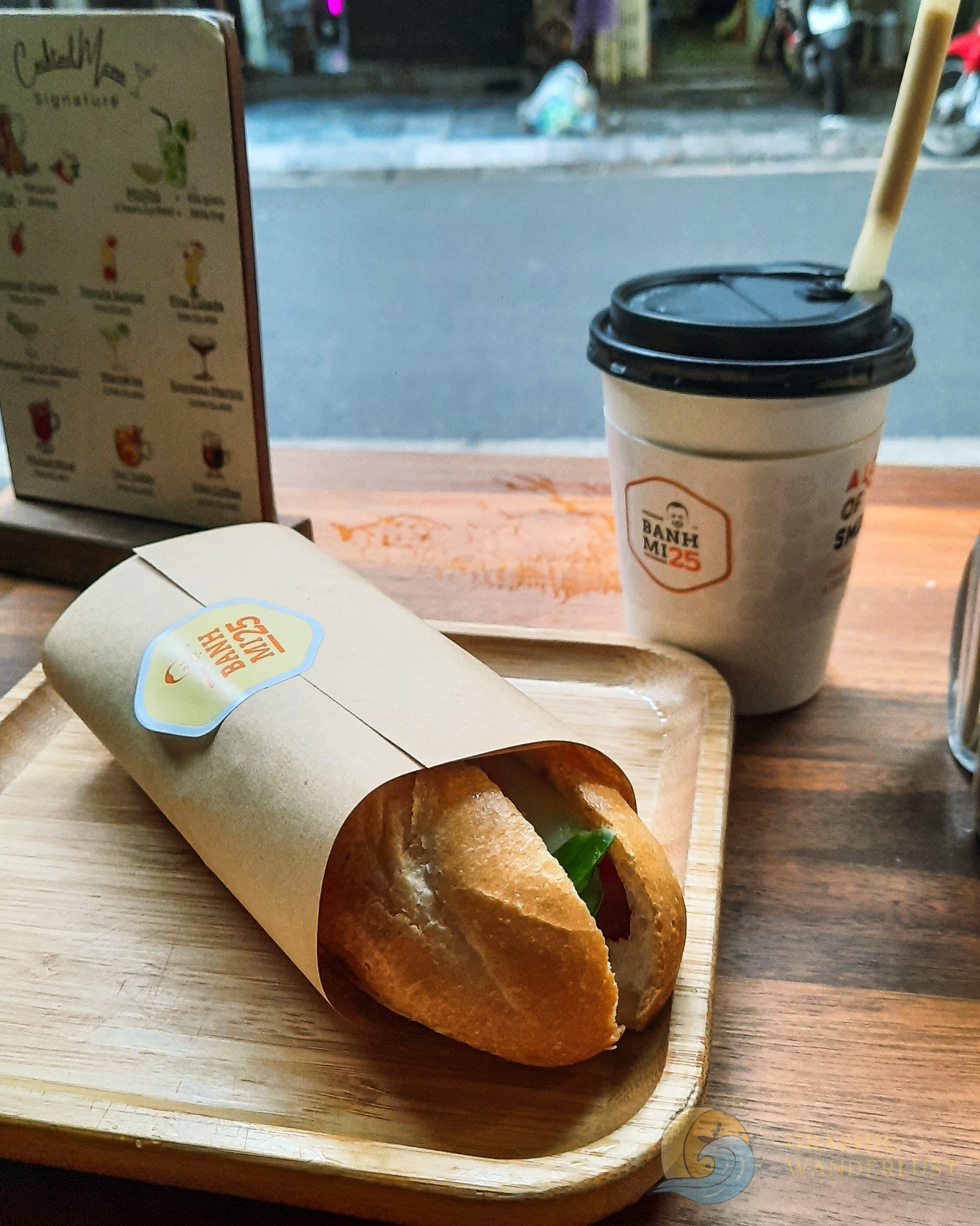 Serving of banh mi and coffee at a streetside eatery