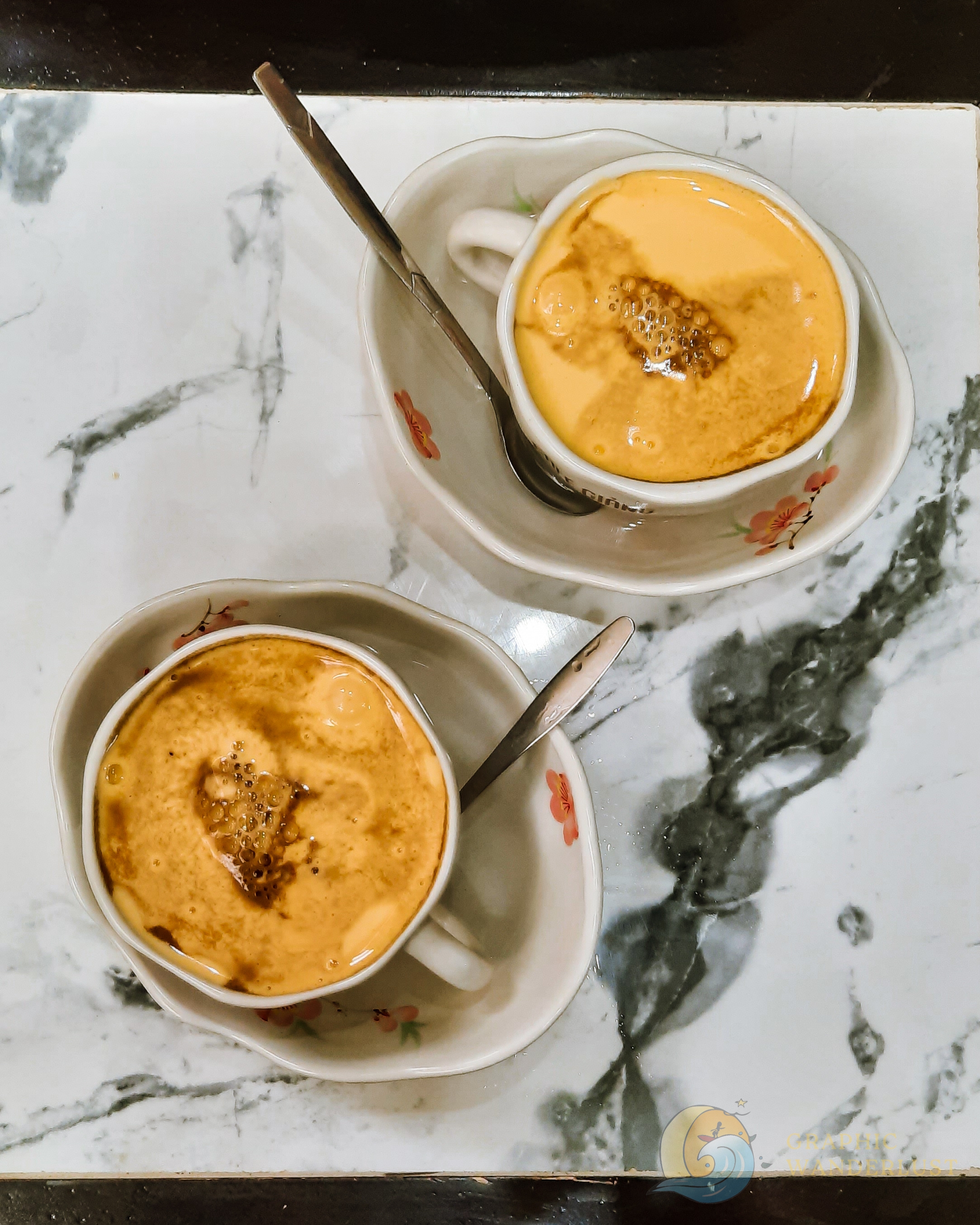 Flat lay shot of two cups of egg coffee
