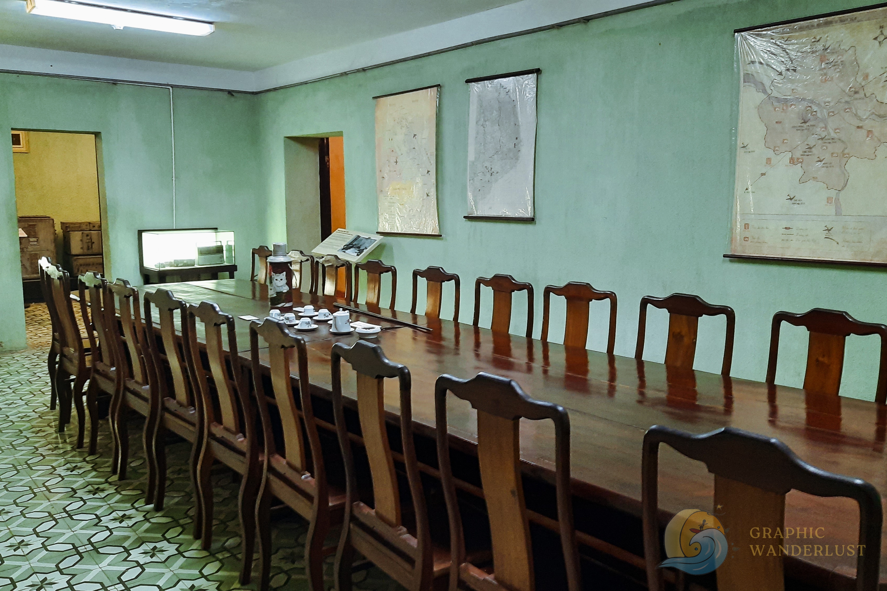 Historical meeting room adorned with original maps in the bunker found in D67 Revolutionary House