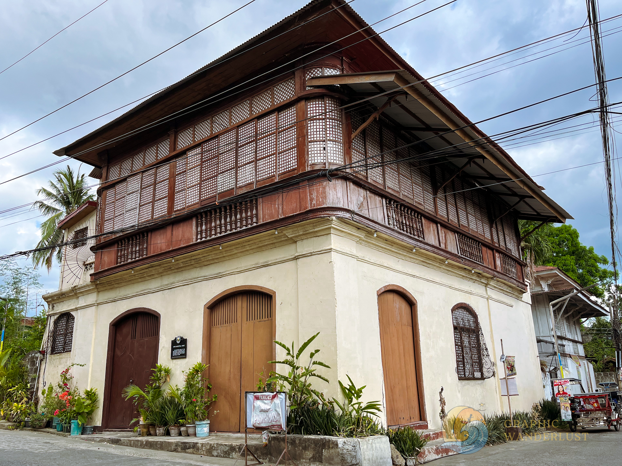 A Spanish colonial house in Batangas, sitting at the corner of a street.