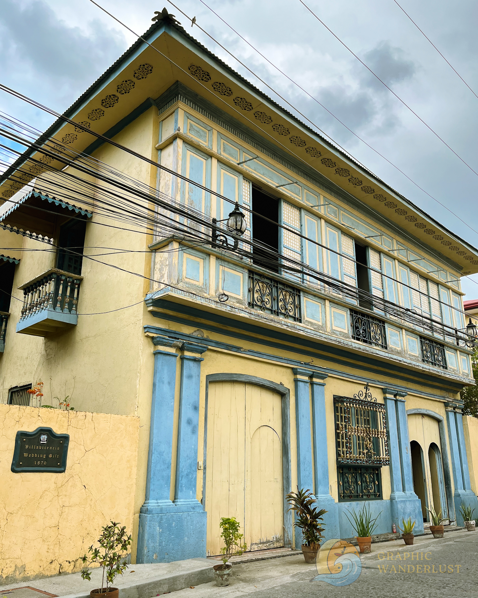 Facade of a Spanish colonial era house in Taal, Batangas dressed in light blue and yellow hues.