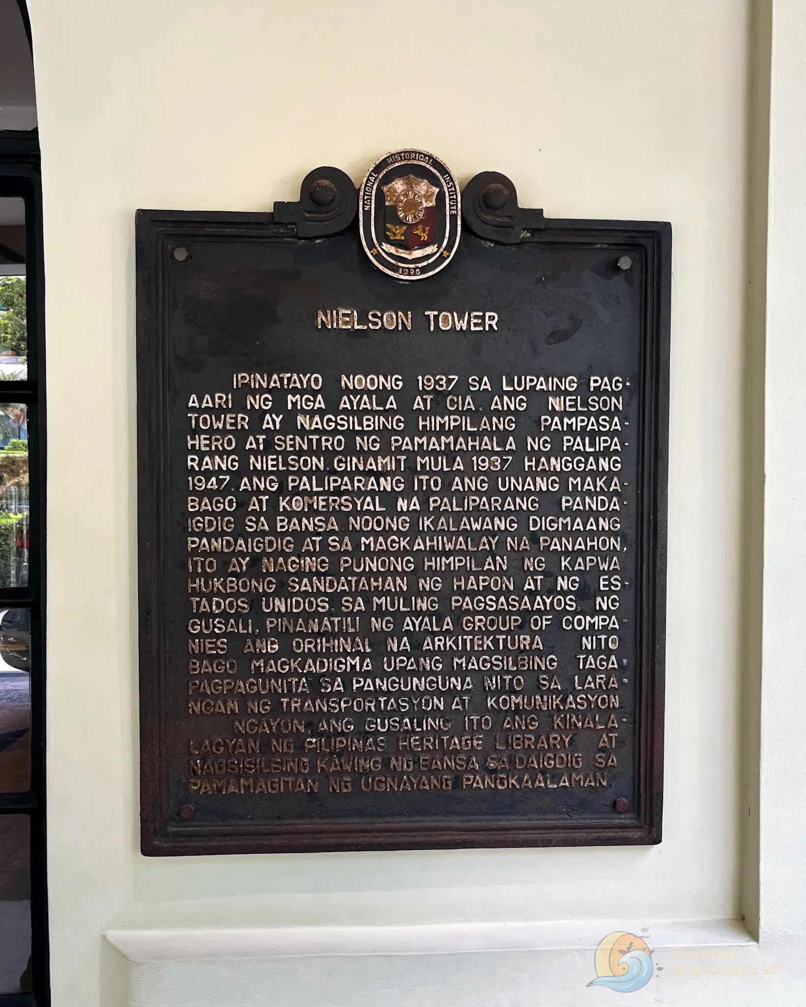 Historical plaque titled “Nielson Tower” with Filipino text describing its history from 1937 to 1947